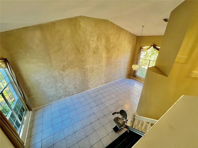 interior space featuring tile patterned flooring and hanging light fixtures