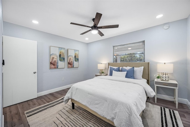 bedroom featuring ceiling fan and dark hardwood / wood-style floors