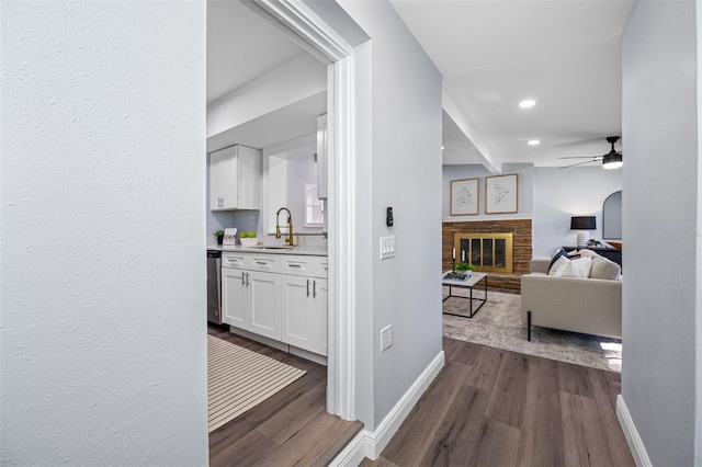 hallway with sink and dark hardwood / wood-style floors