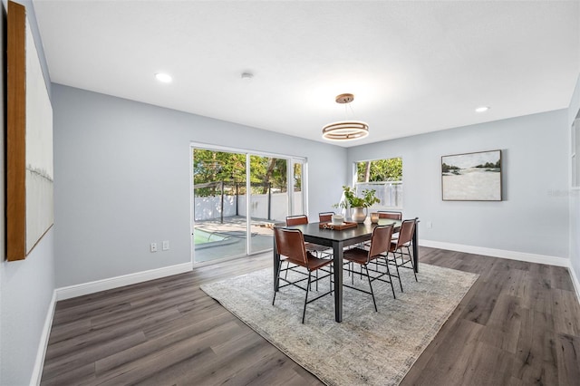 dining area with dark hardwood / wood-style floors