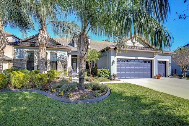 view of front of house with a garage and a front yard