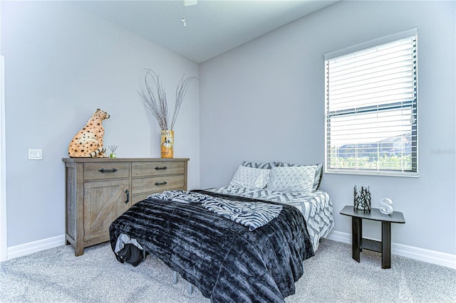 carpeted bedroom featuring vaulted ceiling