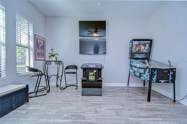 interior space featuring light wood-type flooring and ceiling fan