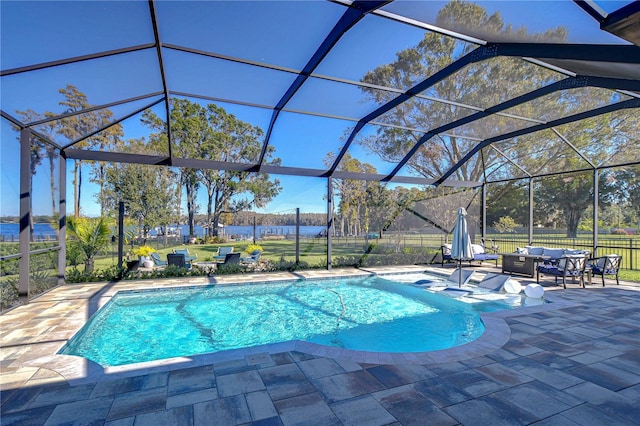 view of swimming pool with glass enclosure and a patio area