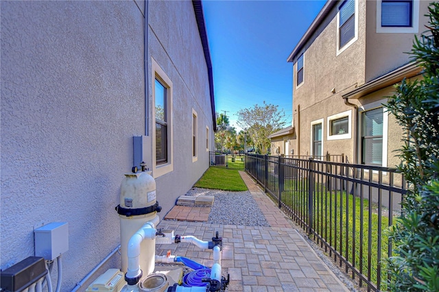 view of property exterior featuring a patio area