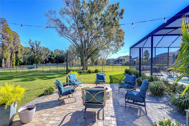 view of patio / terrace featuring a lanai