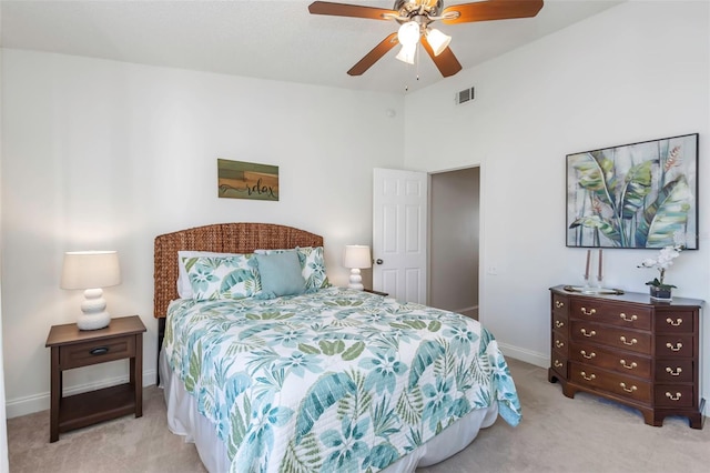 bedroom featuring ceiling fan and light carpet