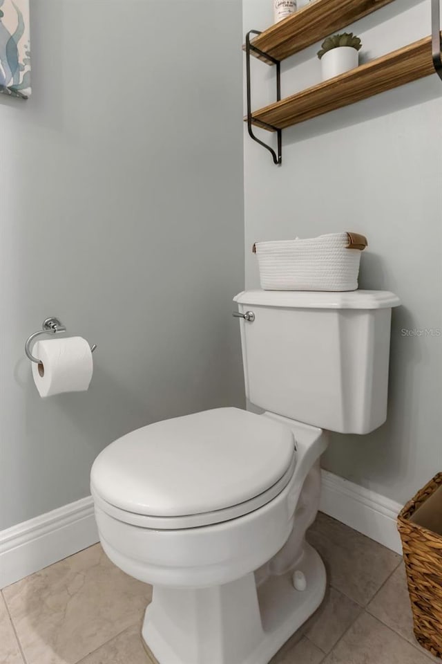 bathroom featuring tile patterned flooring and toilet