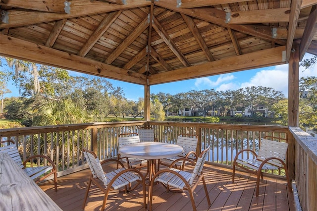 wooden deck featuring a gazebo and a water view