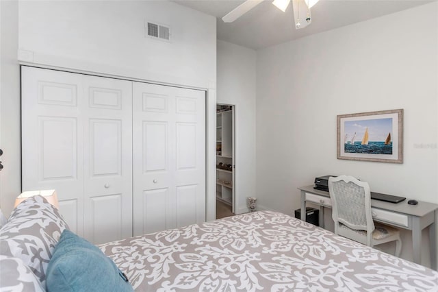 bedroom with ceiling fan and a closet