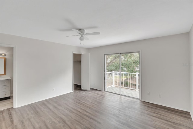 unfurnished room featuring ceiling fan and light hardwood / wood-style floors