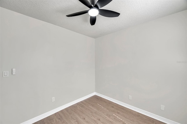 empty room featuring wood-type flooring, a textured ceiling, and ceiling fan