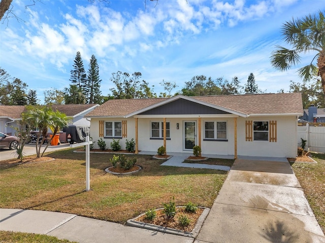 single story home with a front yard and a porch