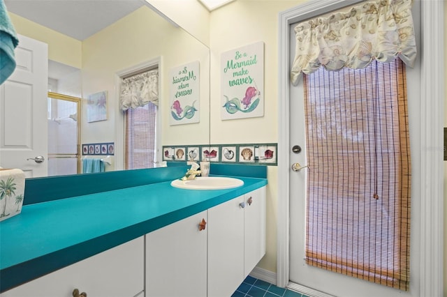 bathroom with vanity and walk in shower