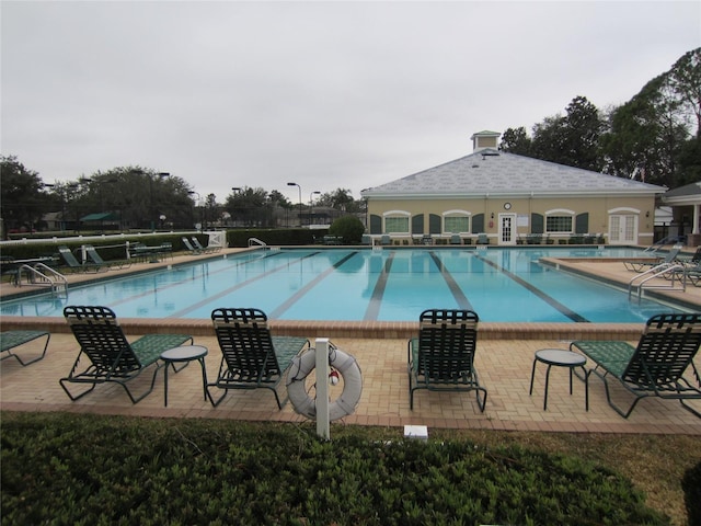 view of pool featuring a patio area