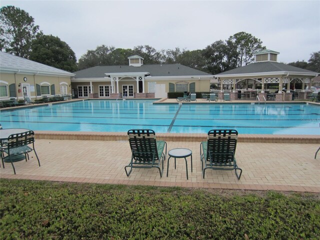 view of pool with a gazebo and a patio