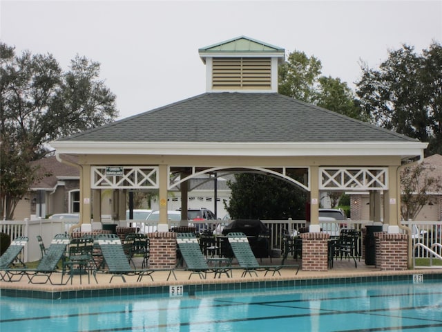 view of swimming pool with a bar