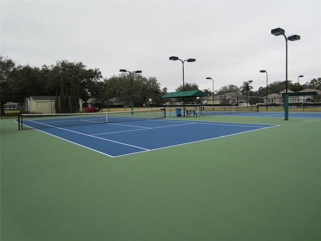 view of sport court with basketball hoop