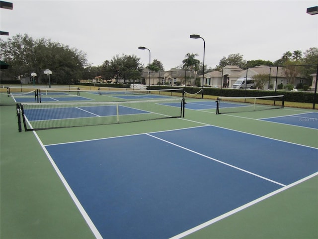 view of tennis court with basketball court