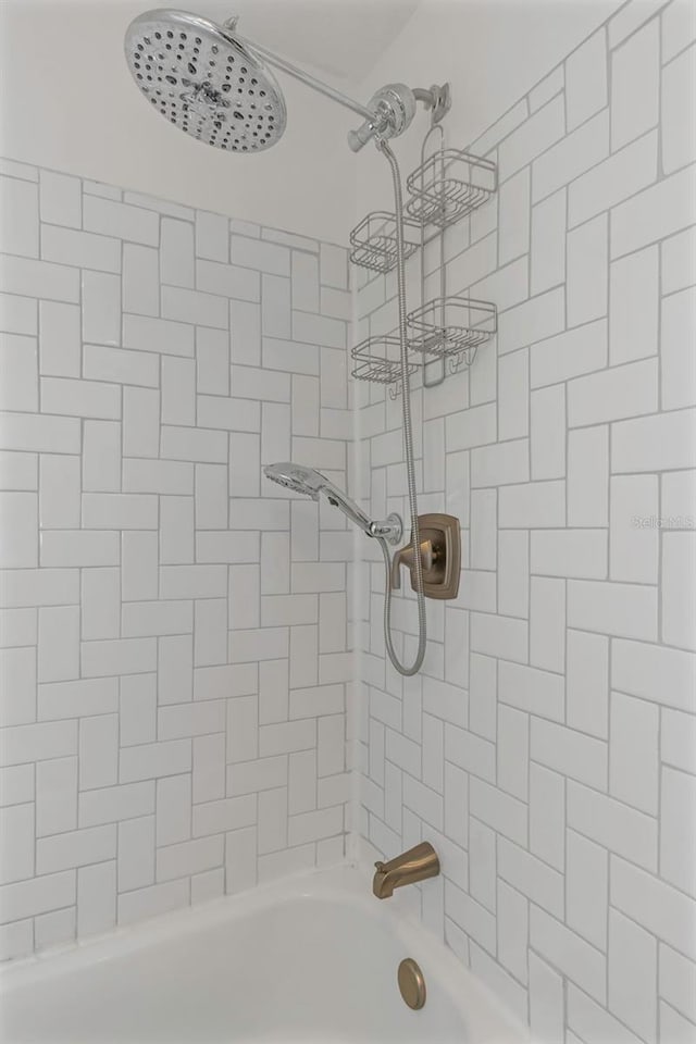 bathroom featuring  shower combination