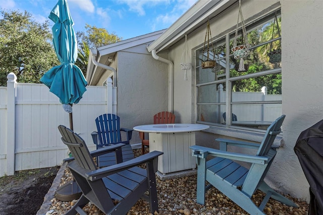 view of patio / terrace featuring fence