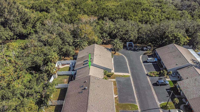 birds eye view of property with a wooded view