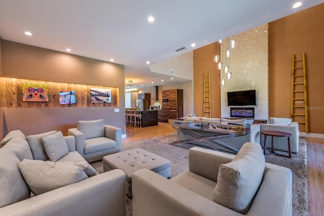 living room featuring a fireplace and light hardwood / wood-style flooring