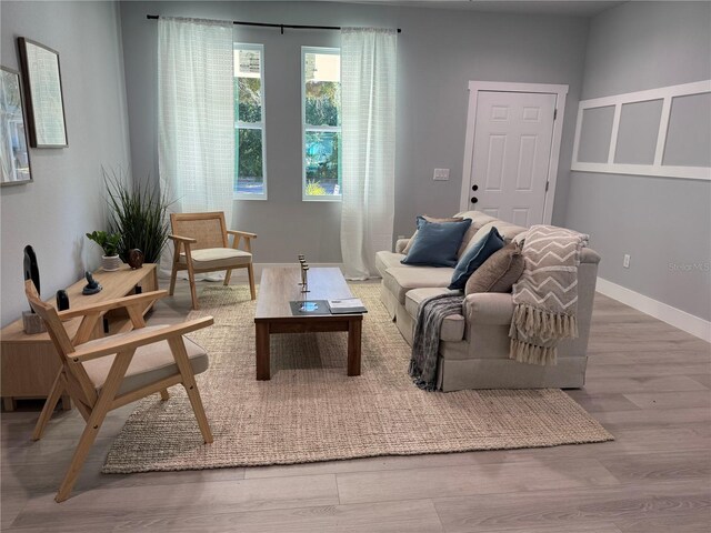 sitting room featuring wood finished floors and baseboards