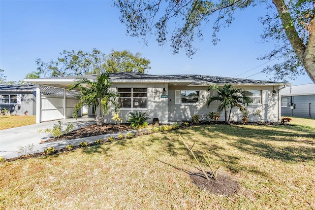 single story home featuring a carport and a front lawn