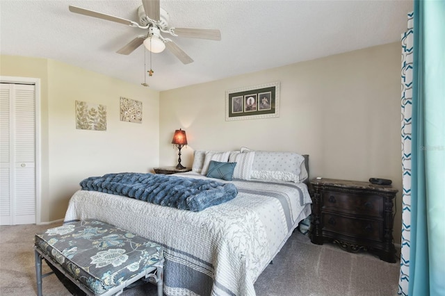 carpeted bedroom featuring a textured ceiling, a closet, and ceiling fan