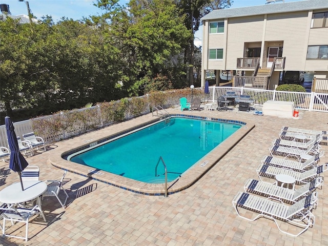 view of swimming pool featuring a patio