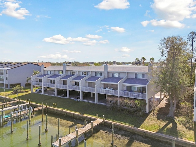 rear view of house with a water view