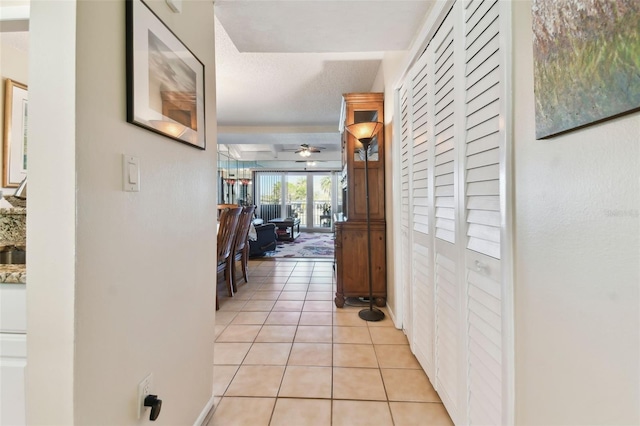 hallway with light tile patterned floors