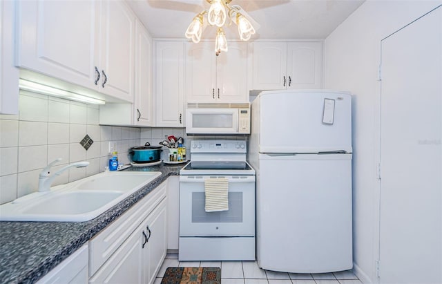 kitchen with white cabinetry, white appliances, sink, and light tile patterned floors