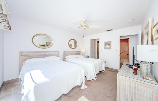 bedroom with ceiling fan and light colored carpet