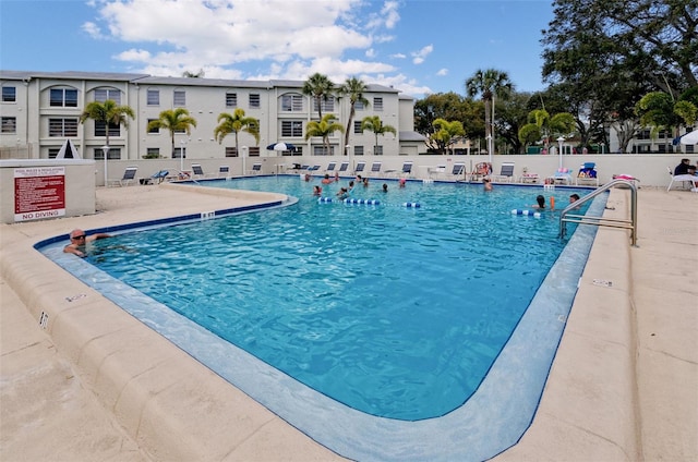 view of swimming pool featuring a patio area