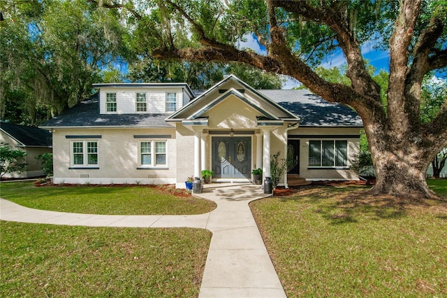 view of front facade with a front lawn