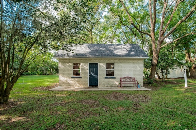 view of outbuilding with a lawn