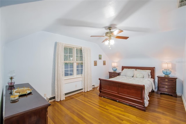 bedroom featuring ceiling fan, wood-type flooring, and vaulted ceiling