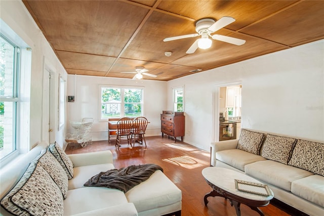 living room with hardwood / wood-style flooring, ceiling fan, and wooden ceiling