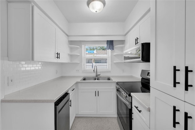 kitchen with decorative backsplash, appliances with stainless steel finishes, white cabinetry, and sink