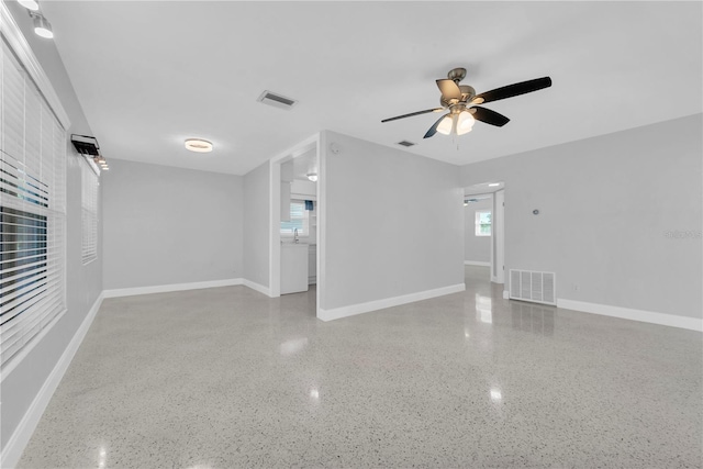 unfurnished room featuring ceiling fan