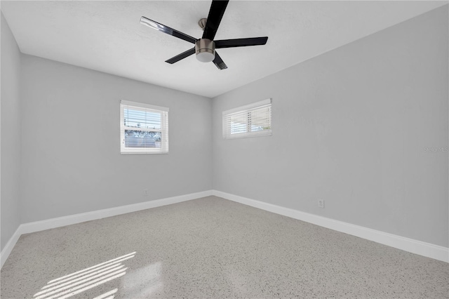 unfurnished room with ceiling fan