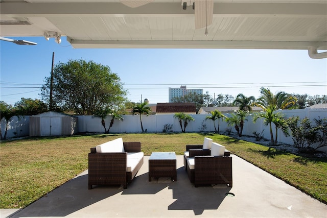 view of patio featuring an outdoor living space and a storage unit