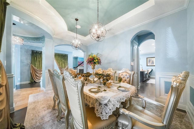 dining room featuring crown molding and a tray ceiling