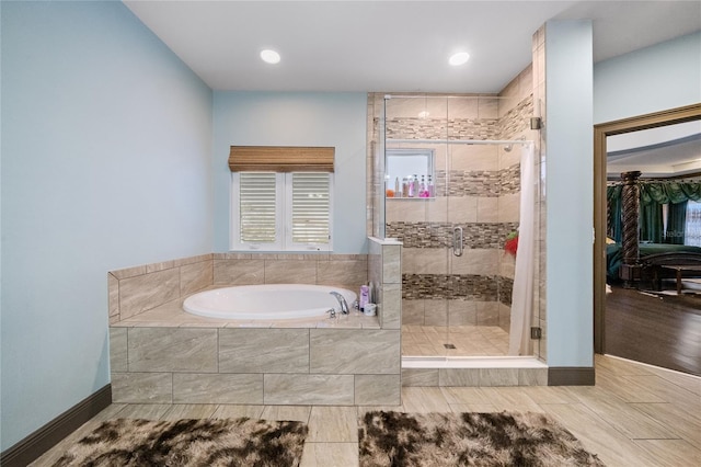 bathroom with shower with separate bathtub