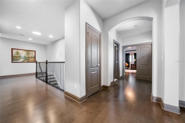 hallway featuring dark wood-type flooring