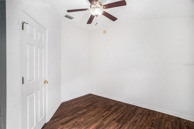 empty room featuring dark hardwood / wood-style flooring, ceiling fan, and lofted ceiling