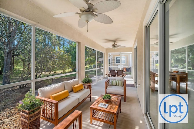 sunroom featuring ceiling fan