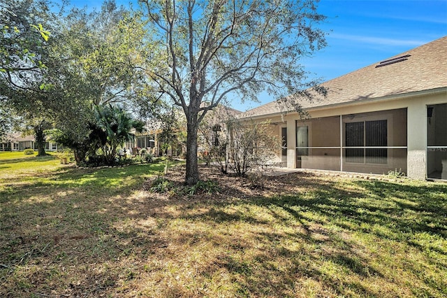 view of yard with a sunroom